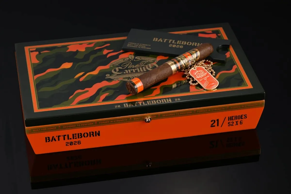 Closed orange and camo Battleborn 2026 box marked 21 / Heroes 52 x 6, with a single cigar and an orange dog tag on the lid