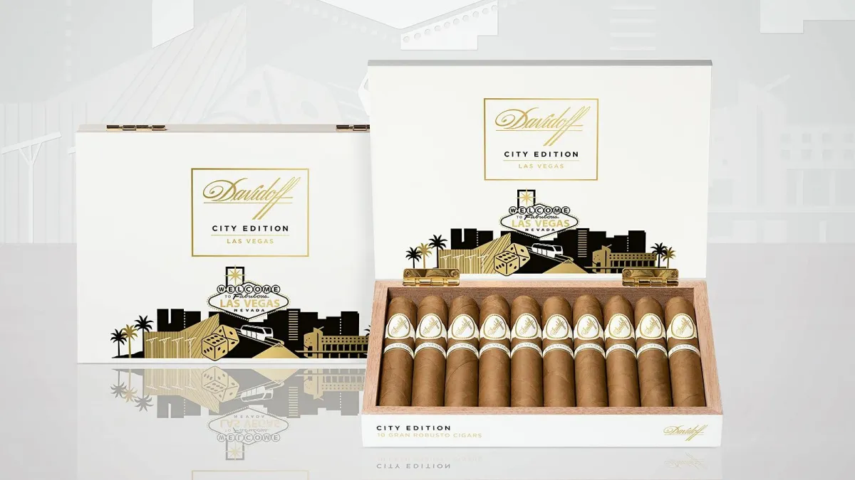 Open white Davidoff City Edition Las Vegas box holding ten gran robusto cigars, with a second closed box behind it showing the Welcome to Fabulous Las Vegas sign in gold and black