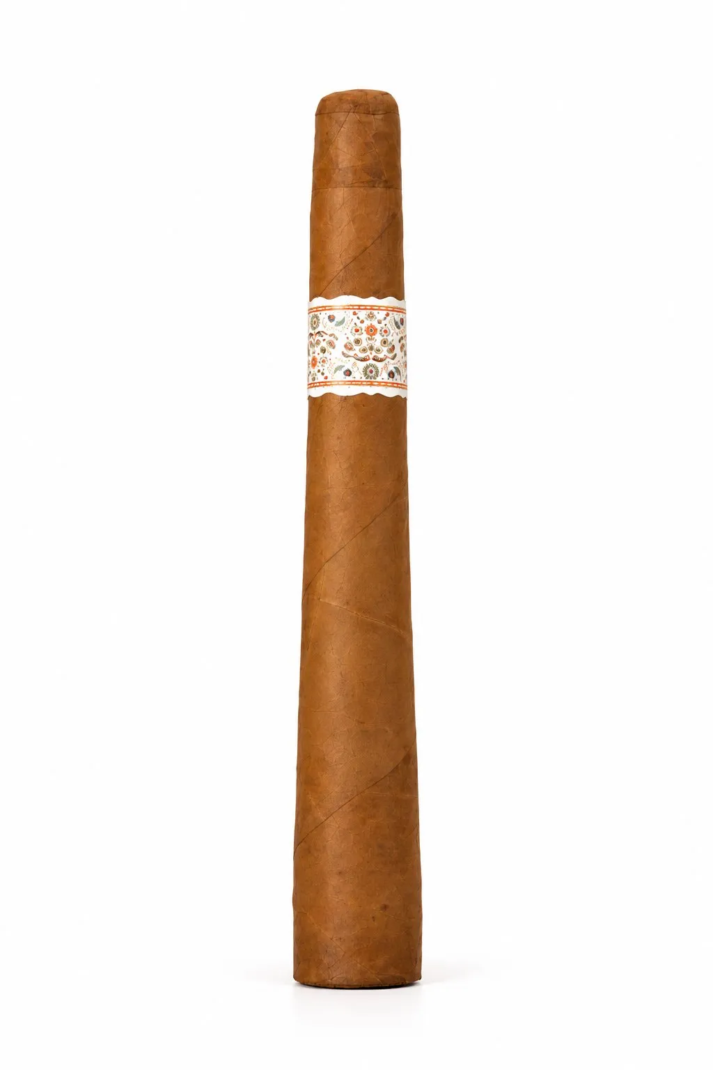 Single MBombay Kesara Pyramid 2020 cigar with a light Connecticut wrapper and a white band with an ornate floral pattern