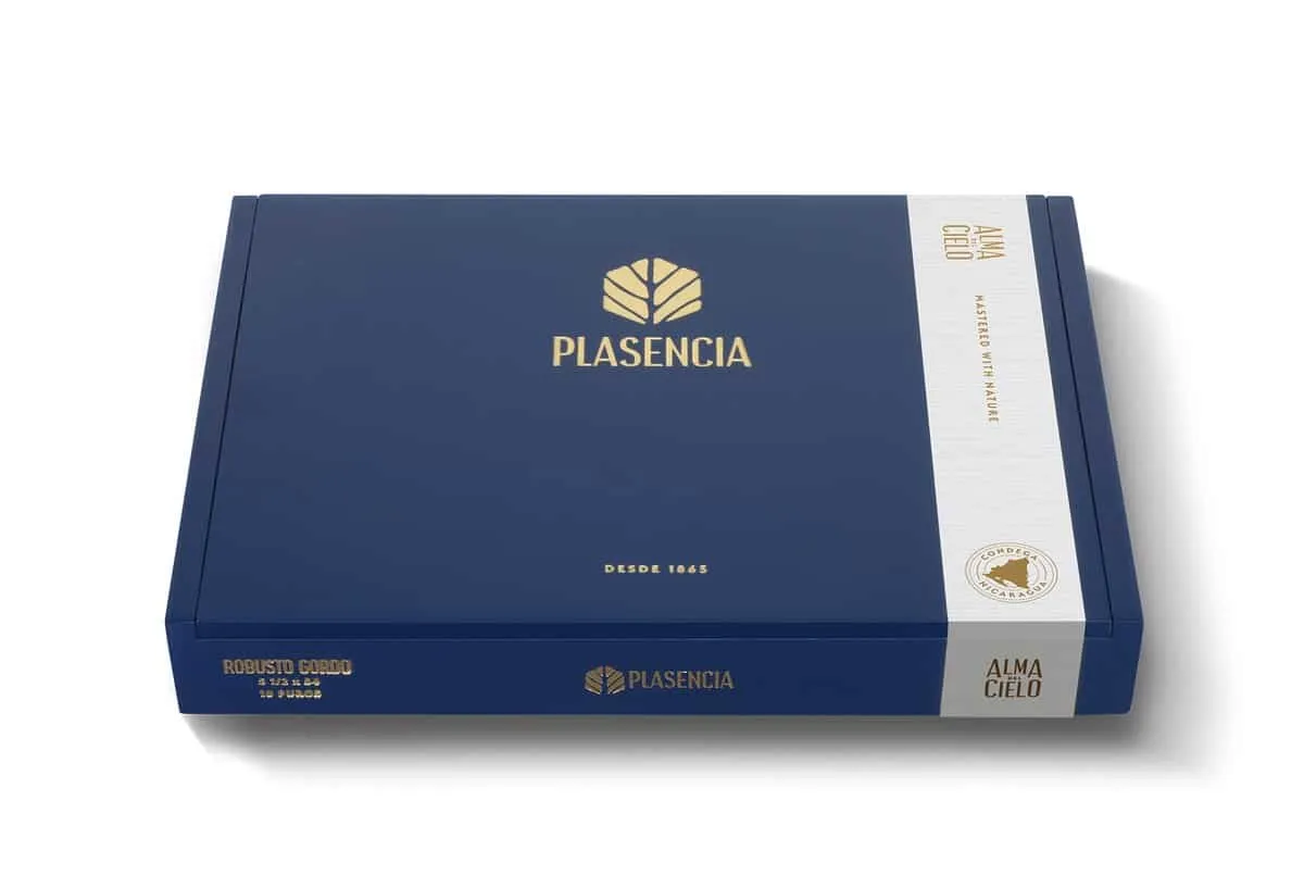 A closed navy blue Plasencia box with gold lettering and a white Alma del Cielo side label, marked Robusto Gordo 5 1/2 x 54, 10 puros