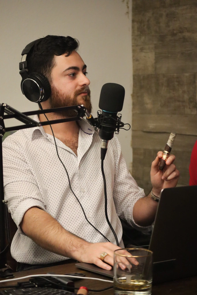 Alex showing off his ash on The Cigar Guys Podcast