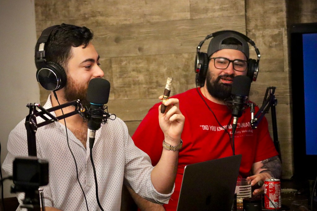 Alex showing off his ash on The Cigar Guys Podcast