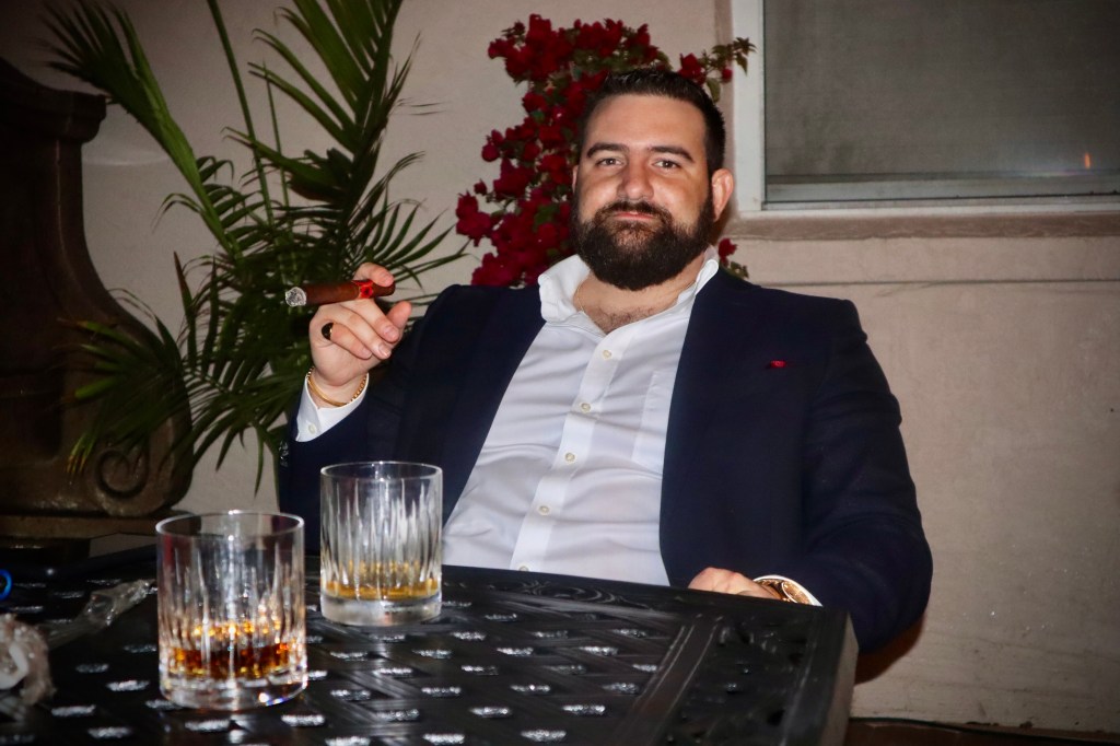 Jared smoking a cigar