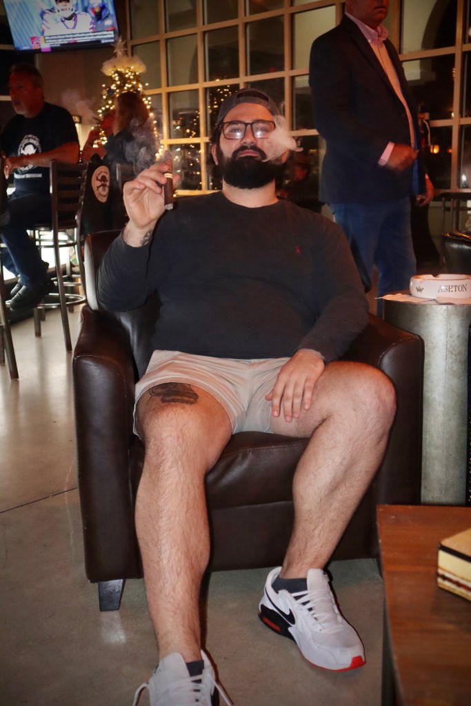 Mark smoking a cigar