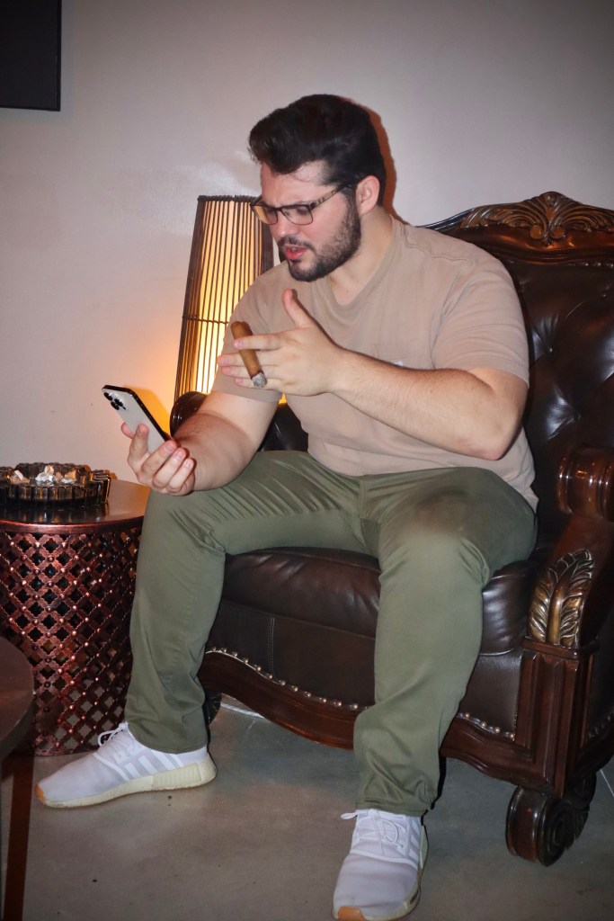 Zach smoking a cigar