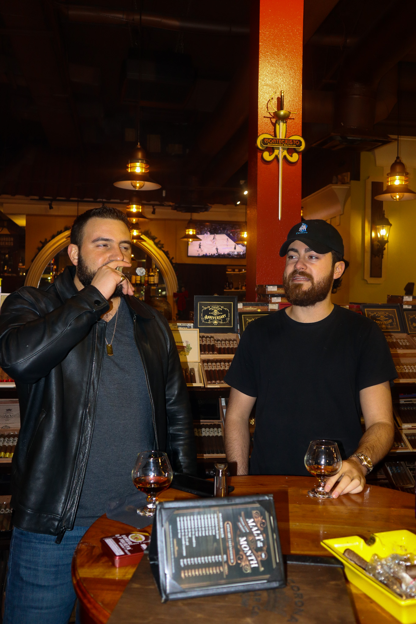 Jared and Alex smoking a cigar