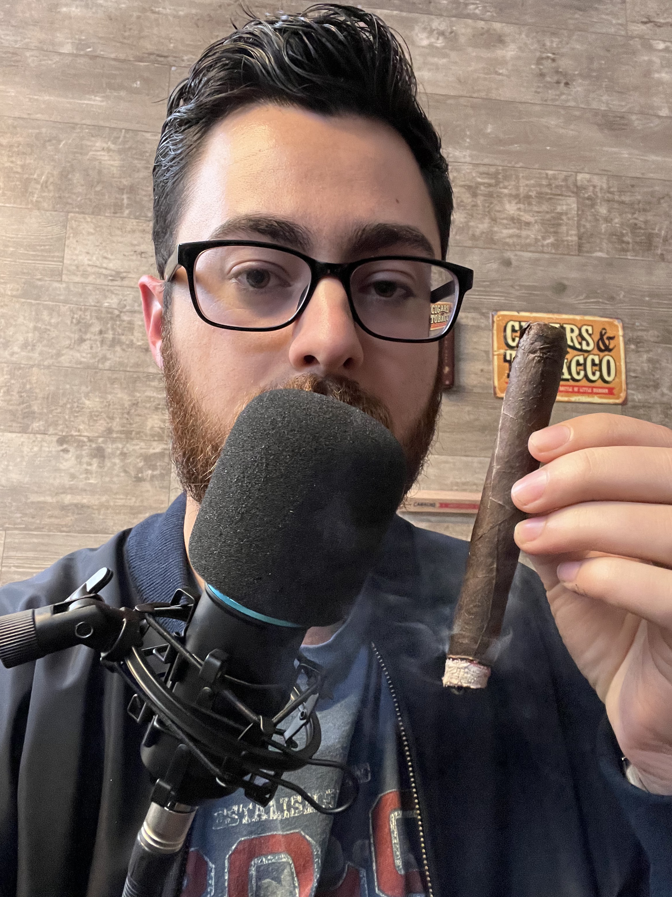 Alex smoking a cigar