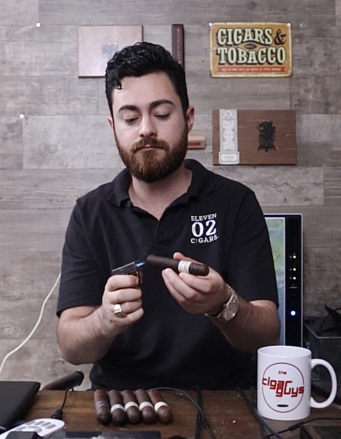 Alex smoking a Liga Privada on The Cigar Guys Reviews
