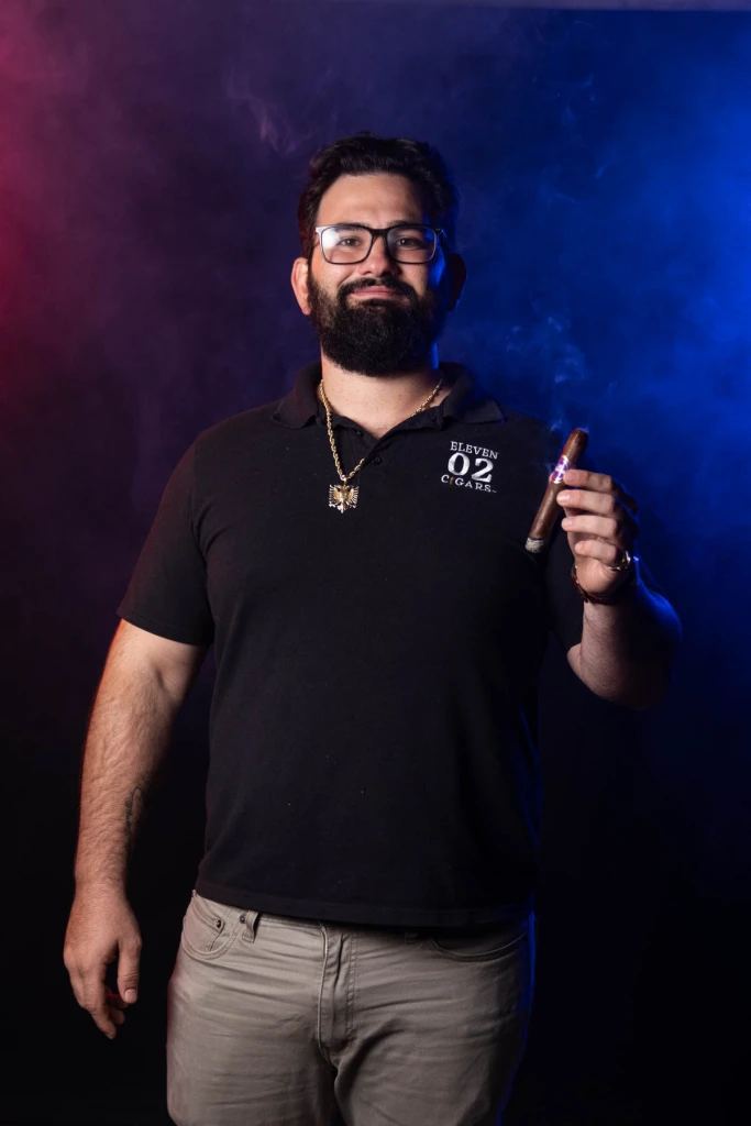 Mark Nikollaj holding a cigar