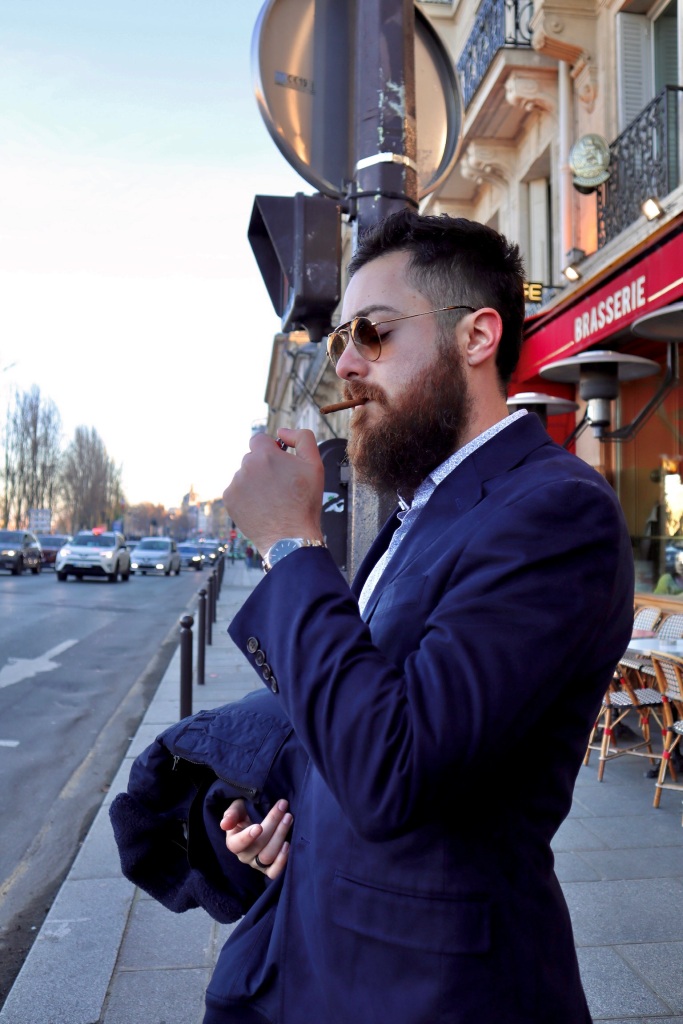 Alexander J Gonzalez lighting cigarillo