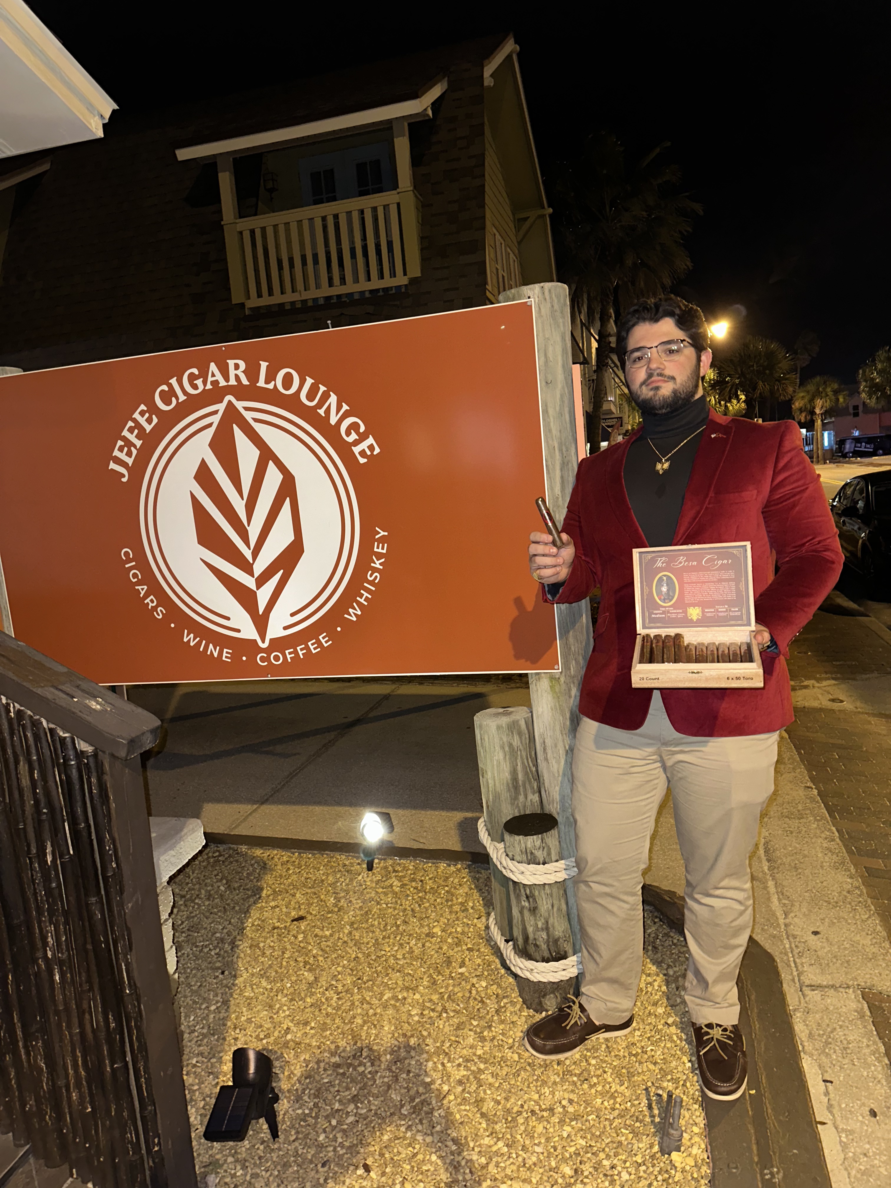 Zachary Nikollaj showcasing The Besa Cigar outside Jefe Cigar Lounge